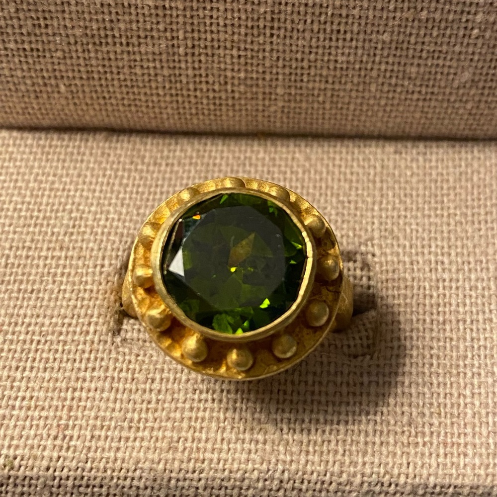 Gold tone and green stone ring.